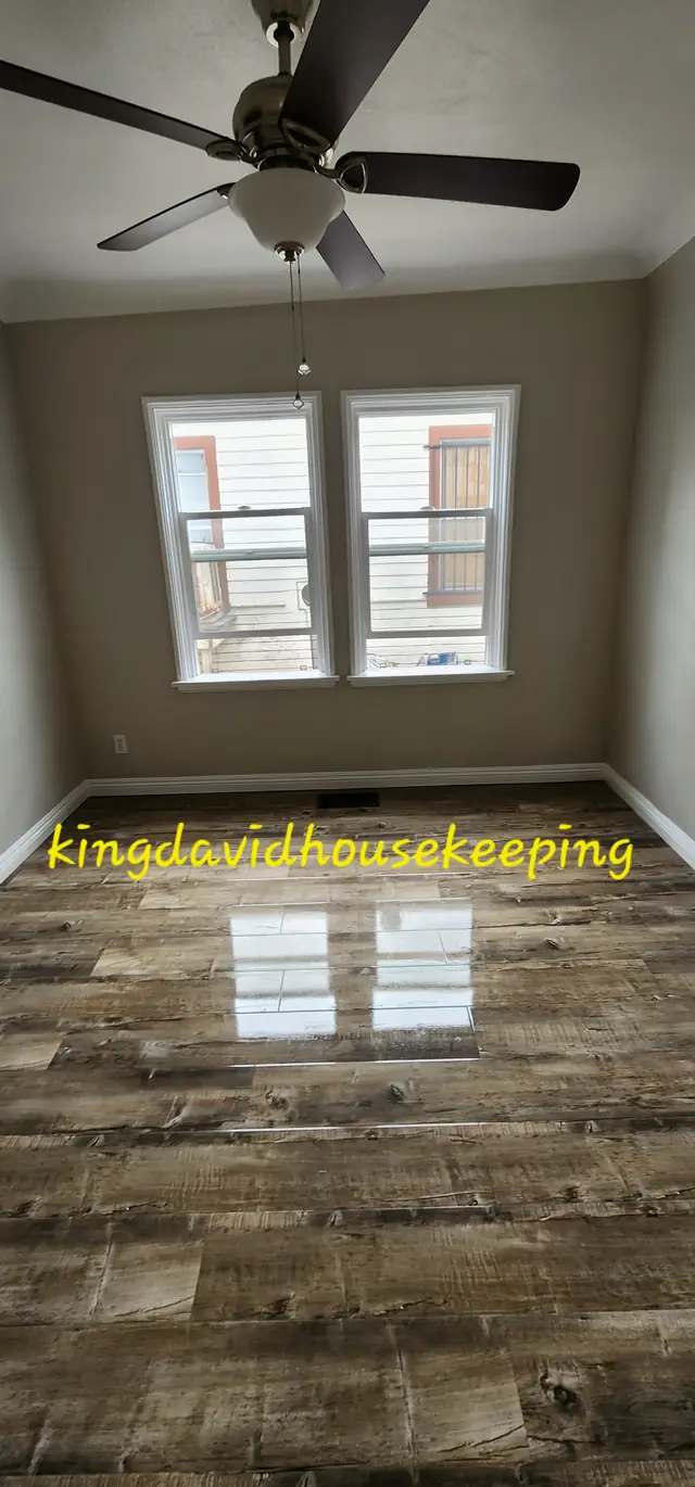 A tall view of a room with a polished floor after cleaning