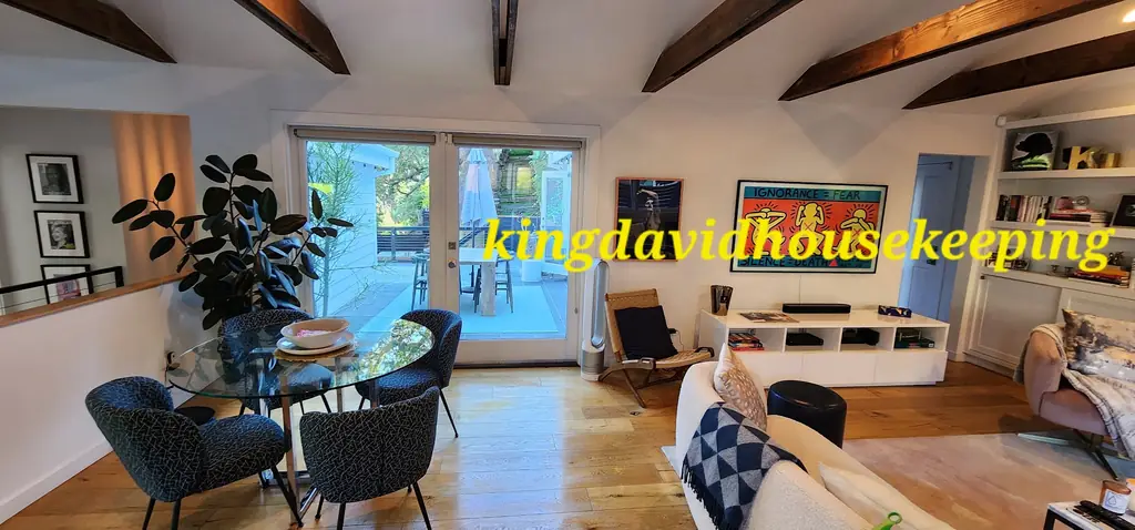 An open living room with a clean floor and clear surfaces