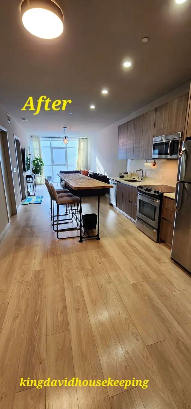 A tall view of a cleaned kitchen and hall after a move-out clean